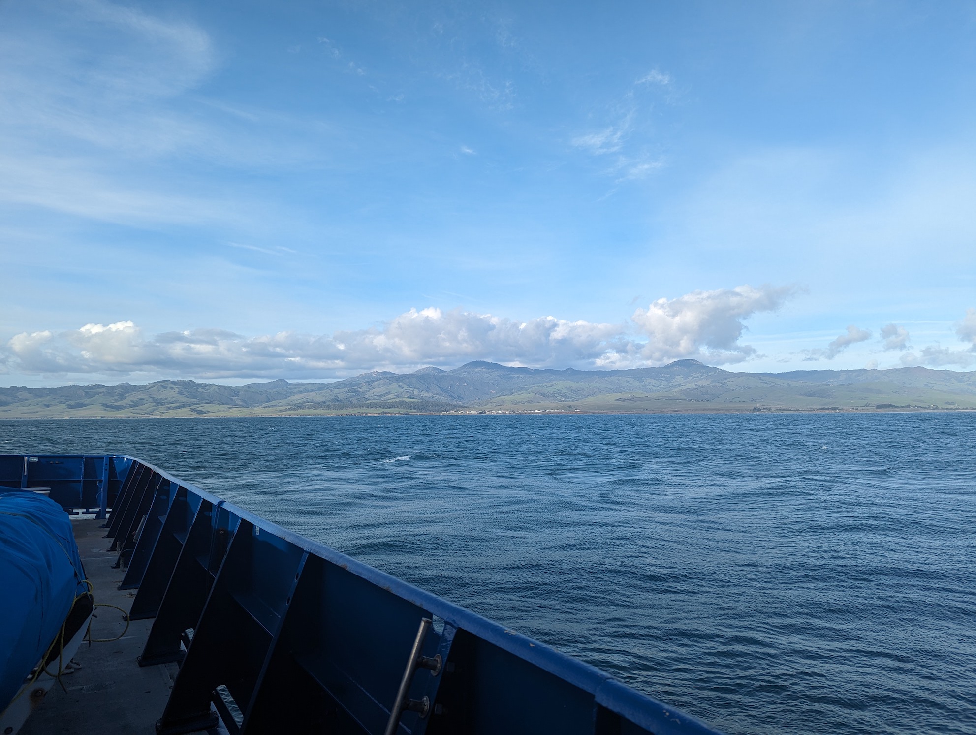 image of fog lingering over the steely gray ocean