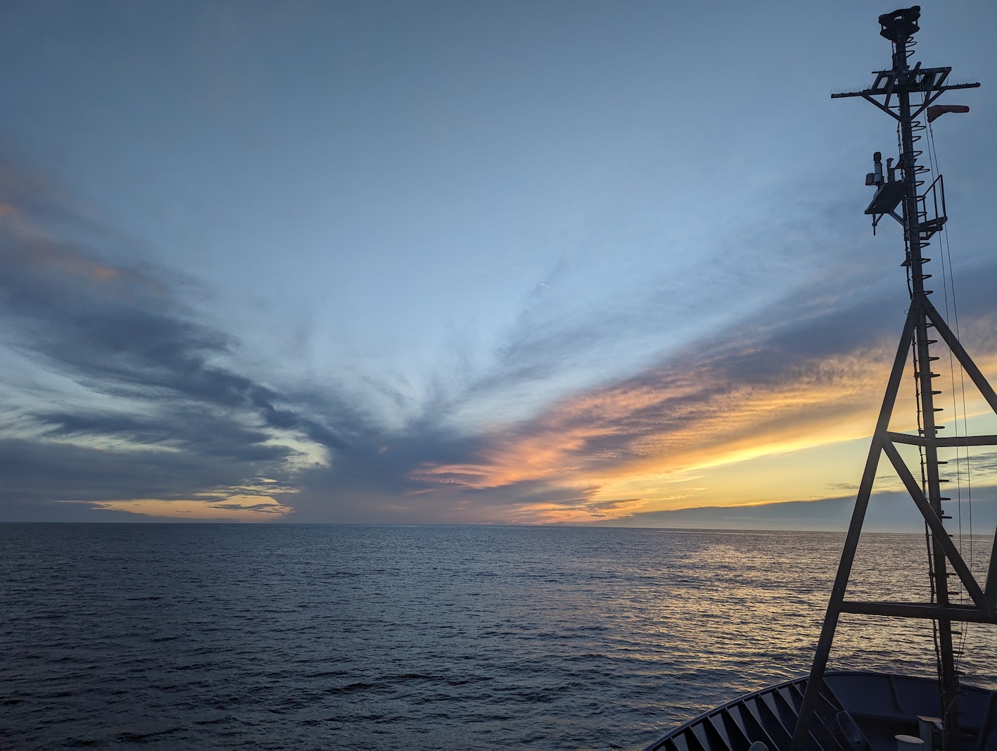 sunset, with large colorful cloud, over the pacific ocean